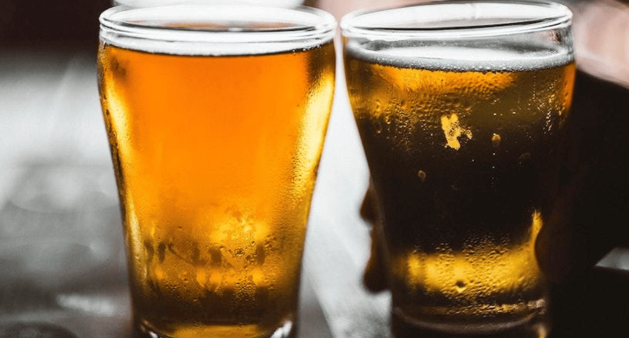 close up of two glasses of beer
