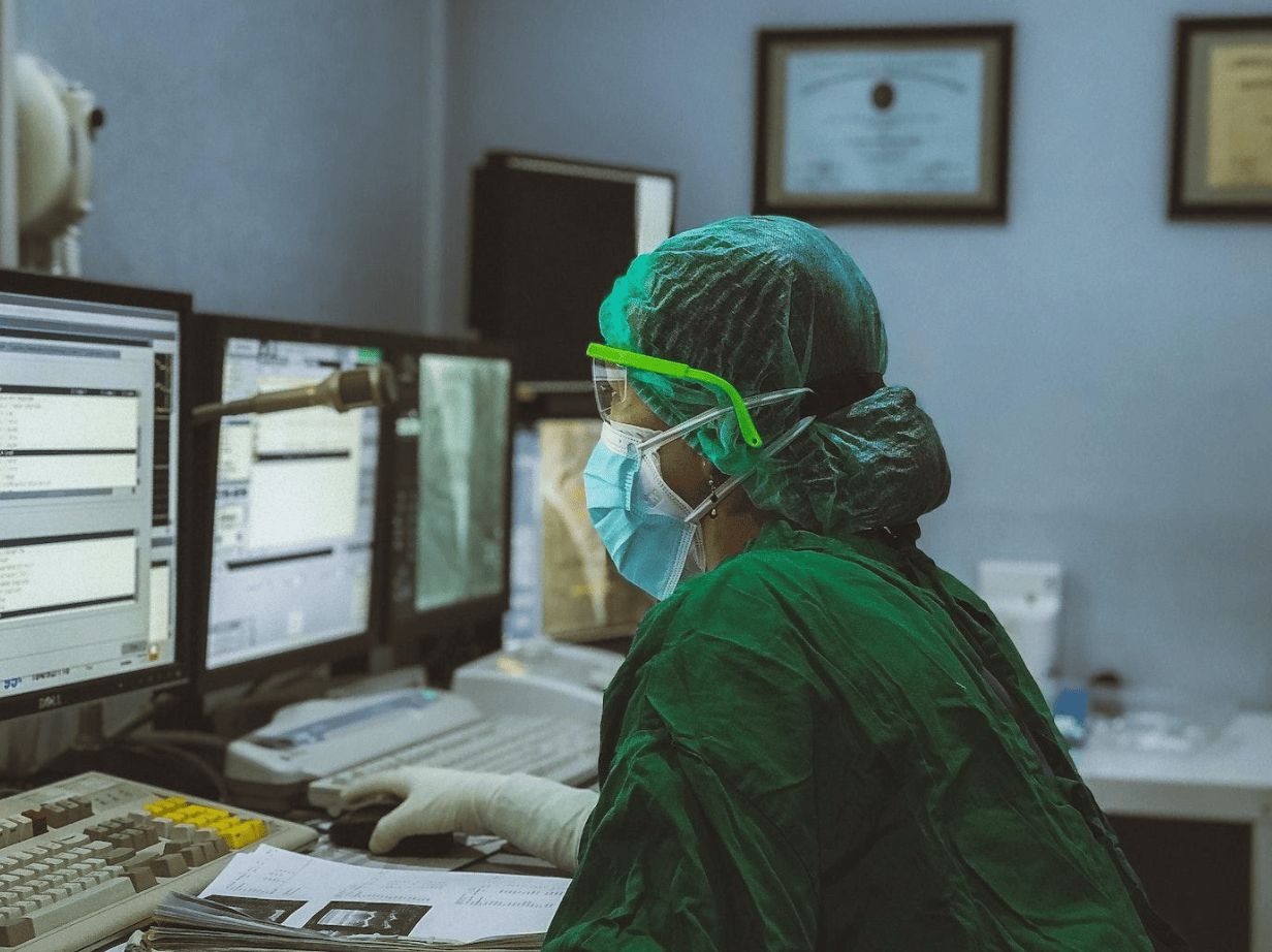 surgeon looking at results on computer