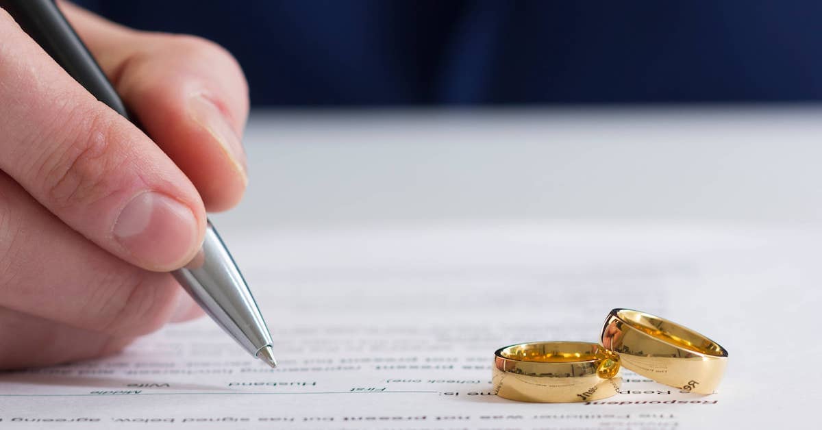A family lawyer assists with divorce papers | The Bishop Law Group