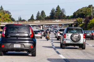 A motorcycle rider lane splitting in Maryland, wondering if it is illegal.